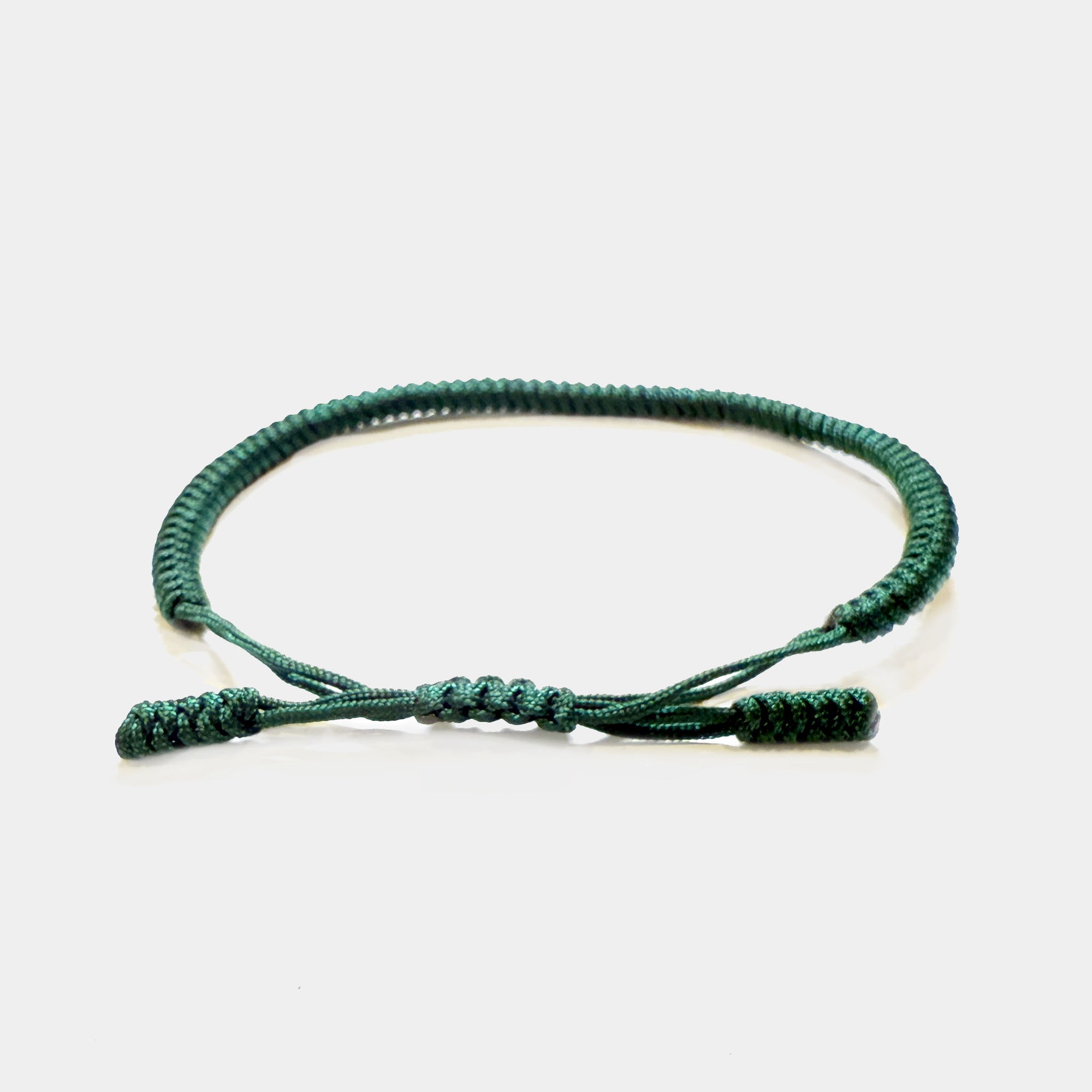 Grünes Knotenarmband